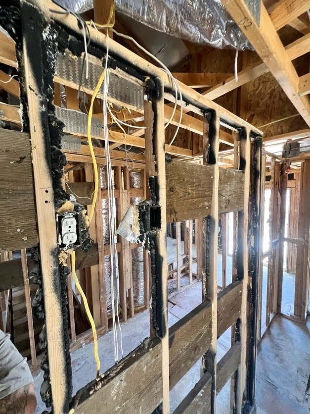 Structural fire and smoke damage to the framing of a Las Vegas home during assessment